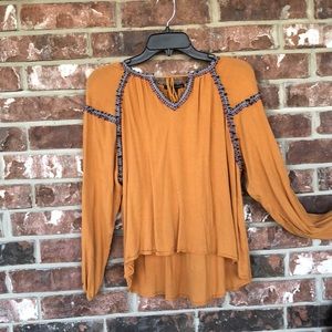Mustard colored blouse with detail